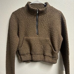 This is a Sherpa half tip crew neck sweater. Super cozy and comfortable